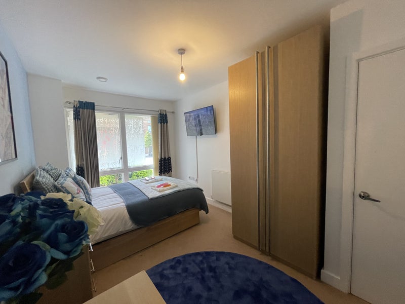 Modern Master Bedroom with Smart TV in New Development